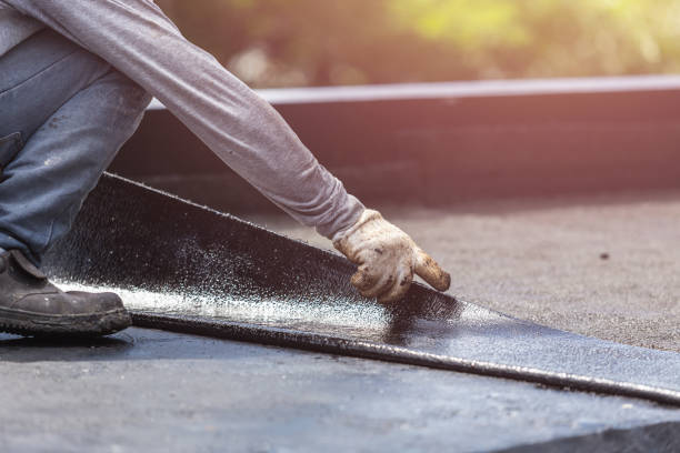 Professional Waterproofing technician working in Flint, MI